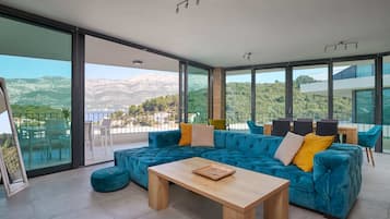 Deluxe Apartment, 2 Bedrooms, Terrace, Sea View (Green Hill 4) | Living area | 140-cm flat-screen TV with satellite channels, TV, Netflix
