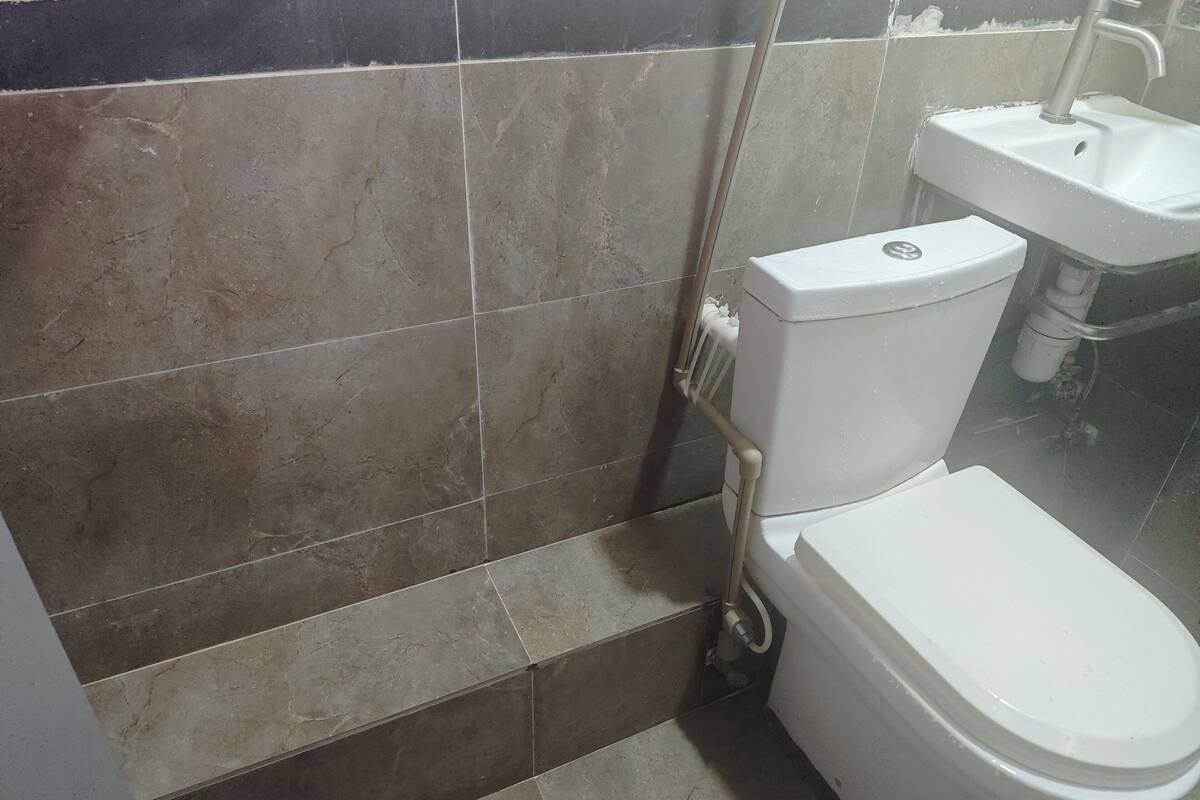 Hair dryer, slippers, shampoo, toilet paper