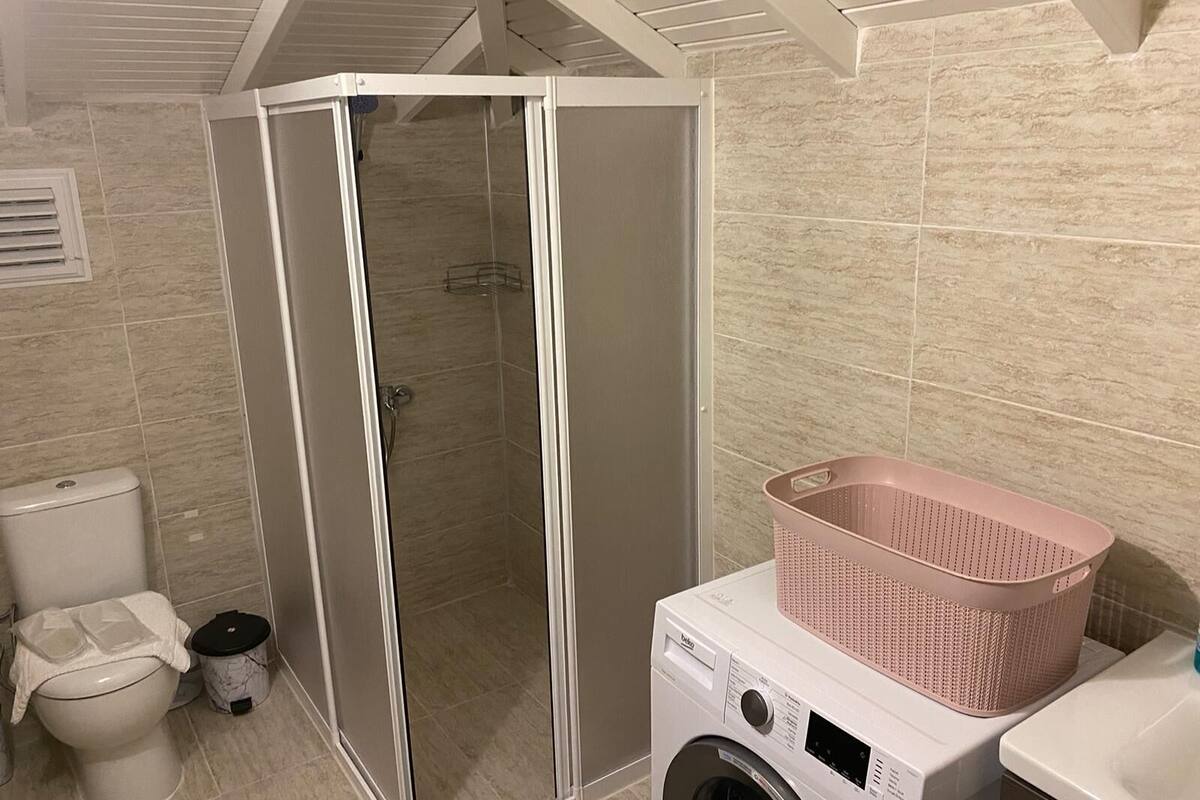 family apartment | bathroom | shower, free toiletries, hair dryer, slippers