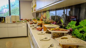 A buffet setup with various dishes and utensils. - Golden Inn Hotel Uzungol (Çaykara)