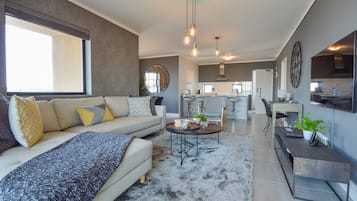 Superior Apartment, 2 Bedrooms (Waters Edge) | Living room | Flat-screen TV