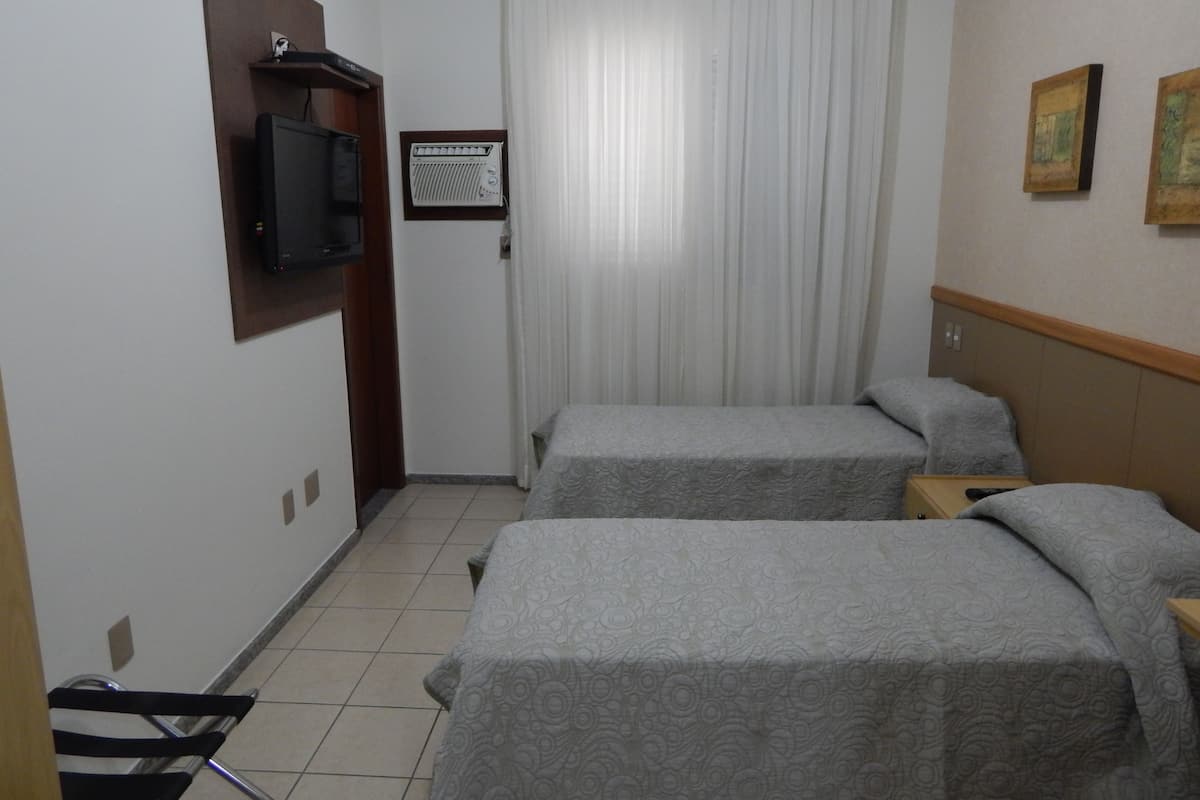 Twin Room | Minibar, in-room safe, desk, blackout curtains