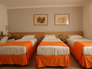 Triple Room | Minibar, in-room safe, desk, iron/ironing board