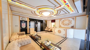 A luxurious hotel lobby with a grand staircase, plush seating, and a decorative ceiling. - Grand Rosa Hotel (Istanbul)
