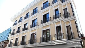 A multi-story hotel with balconies, a classic architectural style, and a sign for 'Grand Rosa Hotel'. - Grand Rosa Hotel (Istanbul)