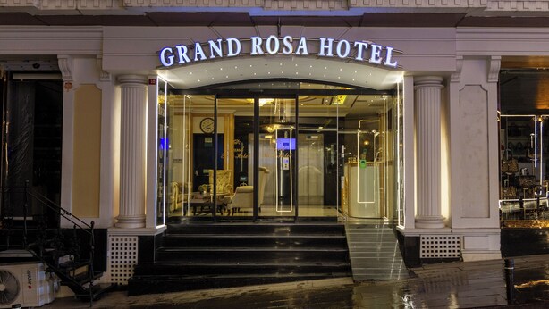 The Grand Rosa Hotel entrance with a grand archway, large glass doors, and a visible elevator. - Grand Rosa Hotel (Istanbul)