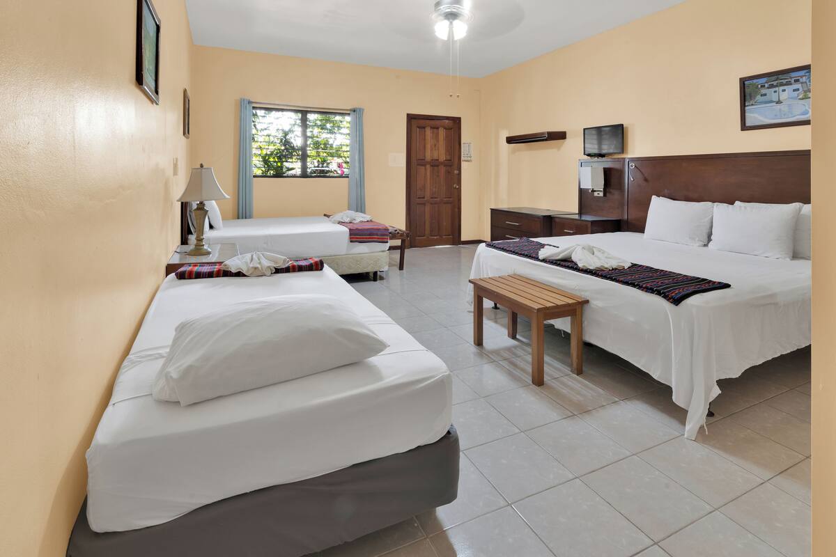 family room, multiple beds | iron/ironing board, free wifi, bed sheets