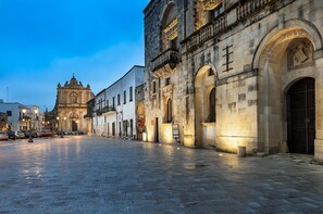A historic stone building with arched windows and a prominent entrance. - Palazzo Muro Leccese Relais de Charme (Muro Leccese)