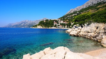On the beach, sun-loungers, beach umbrellas, scuba diving