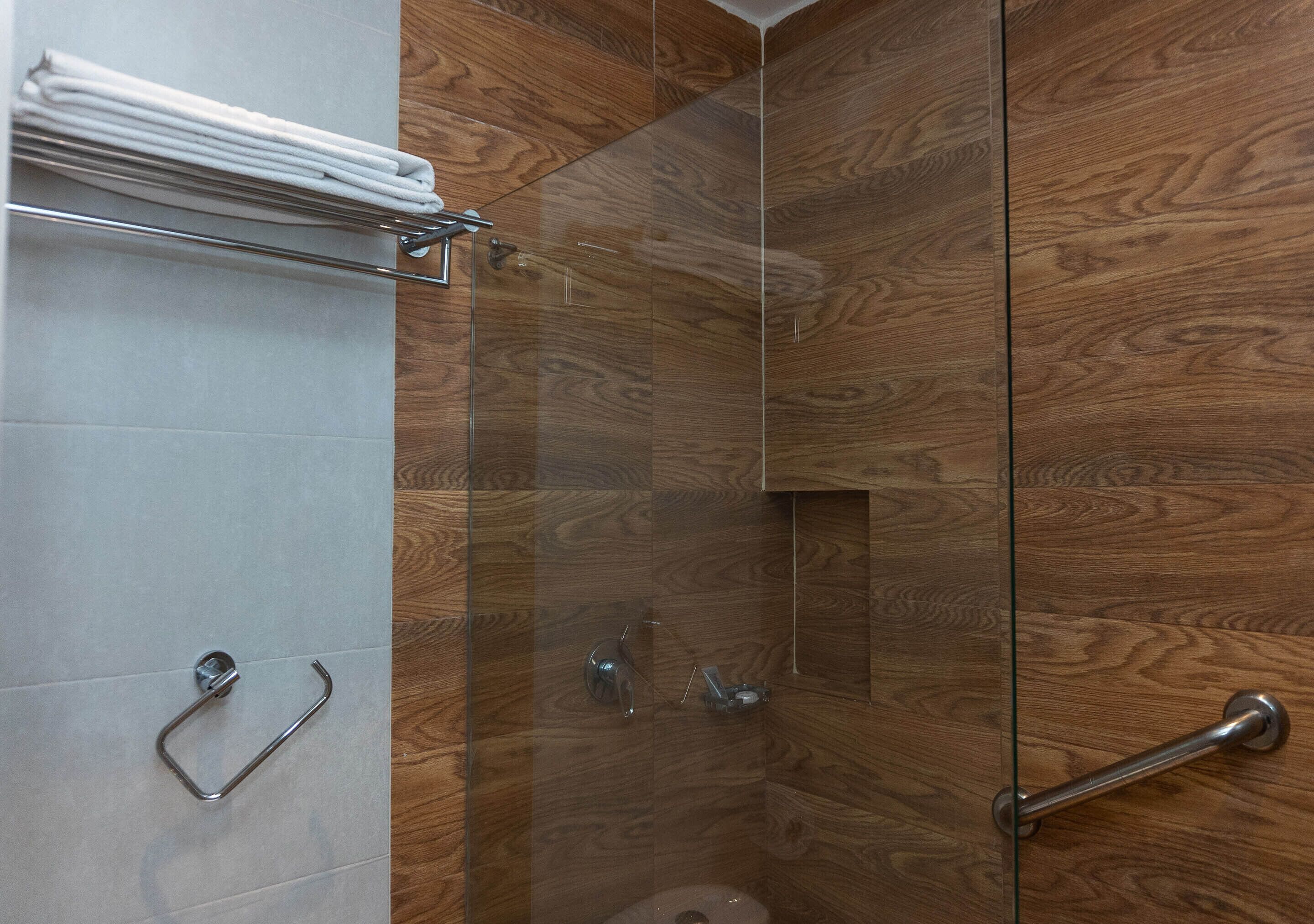 deluxe room, multiple beds | bathroom | shower, rainfall showerhead, free toiletries, hair dryer