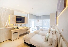 Deluxe Room, Multiple Beds | Minibar, in-room safe, desk, soundproofing