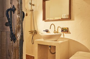 A bathroom with a white sink, a mirror, and a shower. - Sungsan Paradise Hill (Seogwipo)