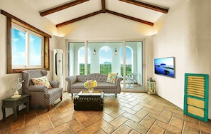 Deluxe Suite | Living room | Flat-screen TV