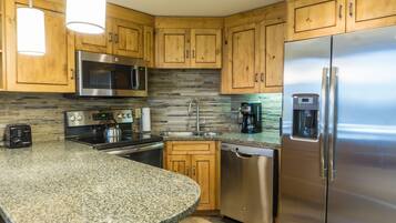 Condo, 2 Bedrooms | Private kitchen | Full-size fridge, microwave, oven, stovetop