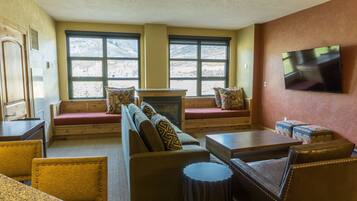 Condo, 1 Bedroom | Living room | Flat-screen TV, fireplace