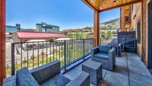 A balcony with wicker furniture, a view of buildings, and a clear sky. - 2 Br 2 Ba Luxury Condo. Walk to South Lake Tahoe! (South Lake Tahoe)