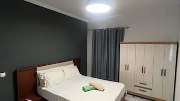 Apartamento, 2 quartos | Roupas de cama premium, ferros/tábuas de passar roupa