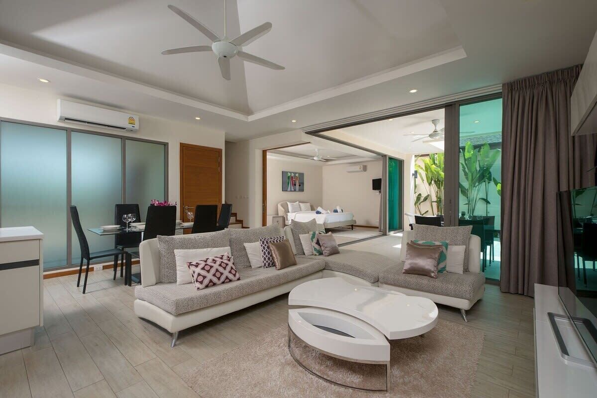 Standard Villa, Pool View | Living area | 50-inch Smart TV with cable channels, DVD player