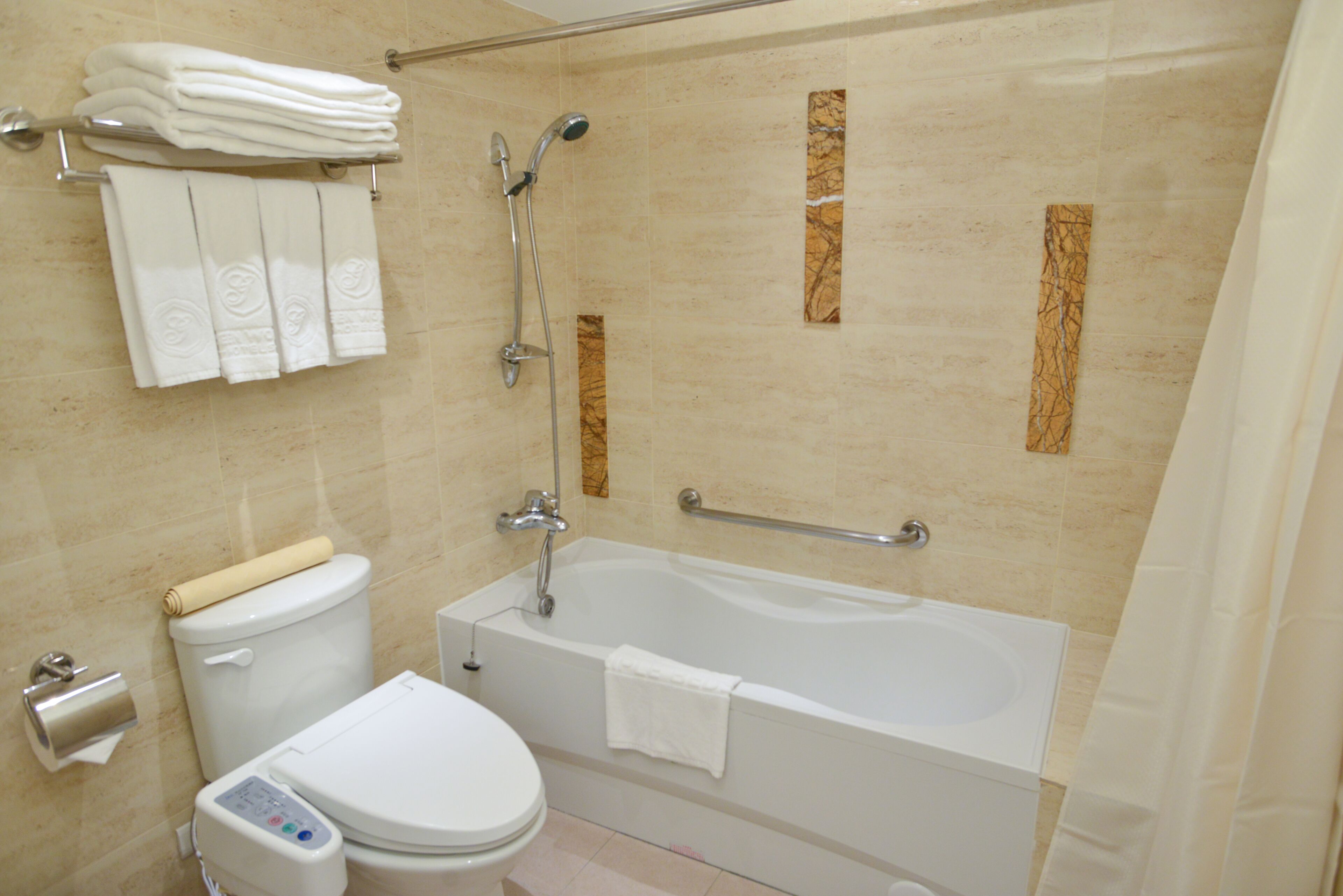 standard family room | bathroom | hair dryer, towels, toilet paper