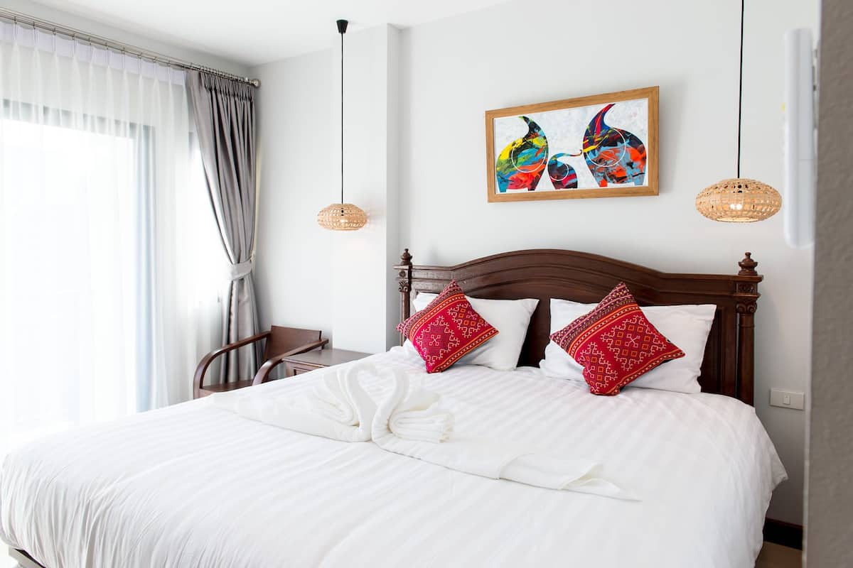 Deluxe King Room with Balcony | In-room safe, free WiFi, bed sheets