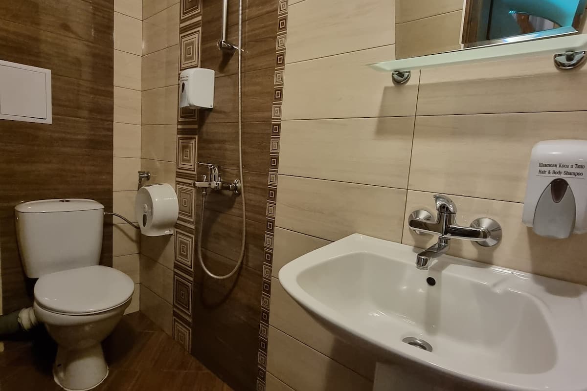 superior triple room, 1 queen bed with sofa bed, garden view | bathroom | free toiletries, hair dryer, bathrobes, slippers