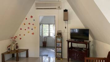 Family Triple Room, 1 Bedroom, Valley View, Garden Area | Living area | 32-inch TV with cable channels
