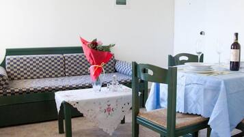 Apartment, 1 Bedroom, Sea View | Living area | Flat-screen TV