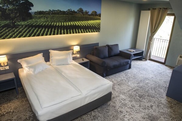 Habitación doble | Ropa de cama de alta calidad y minibar 