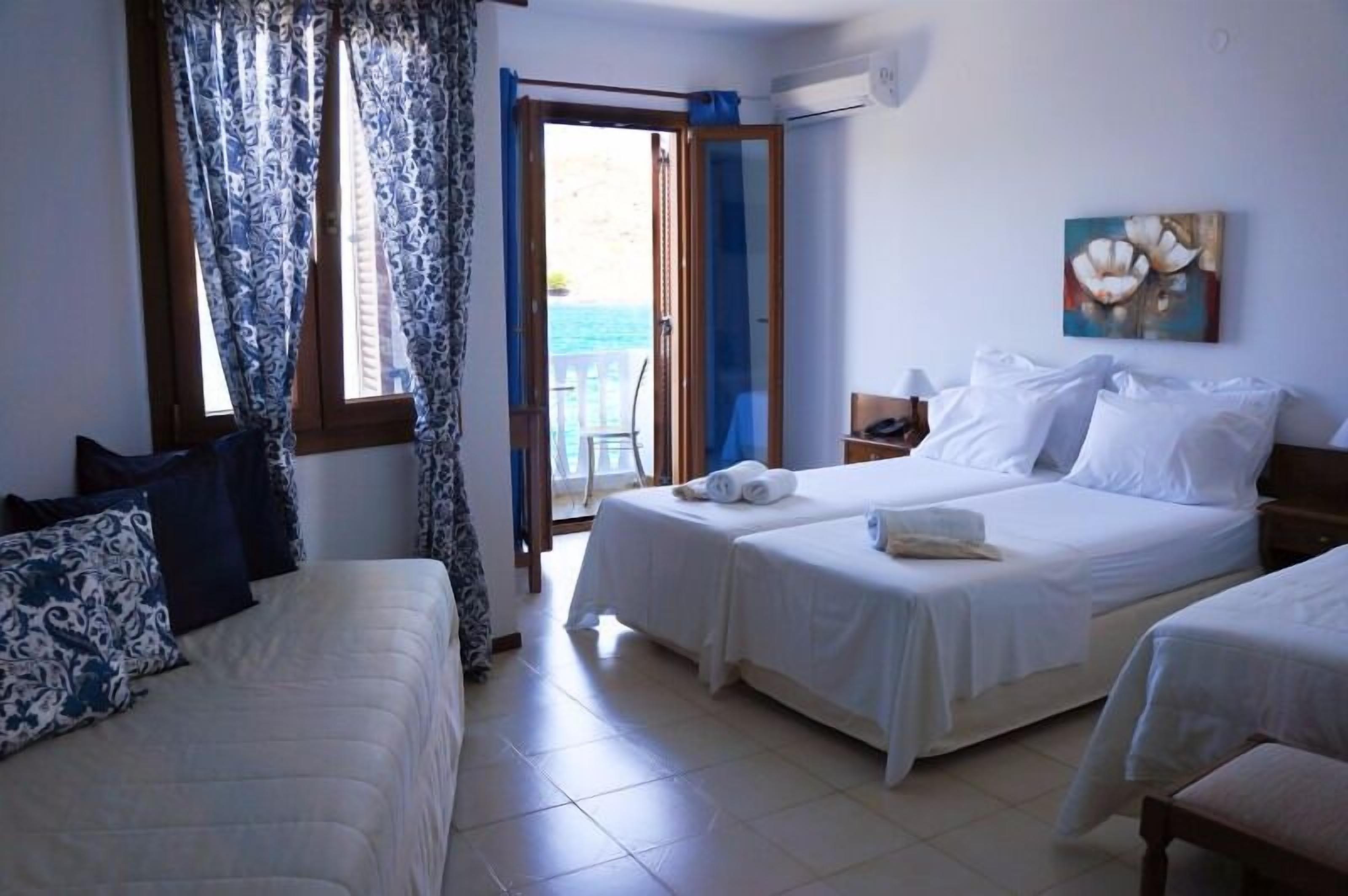 triple room, pool view (extra bed) | in-room safe, soundproofing, iron/ironing board, free wifi