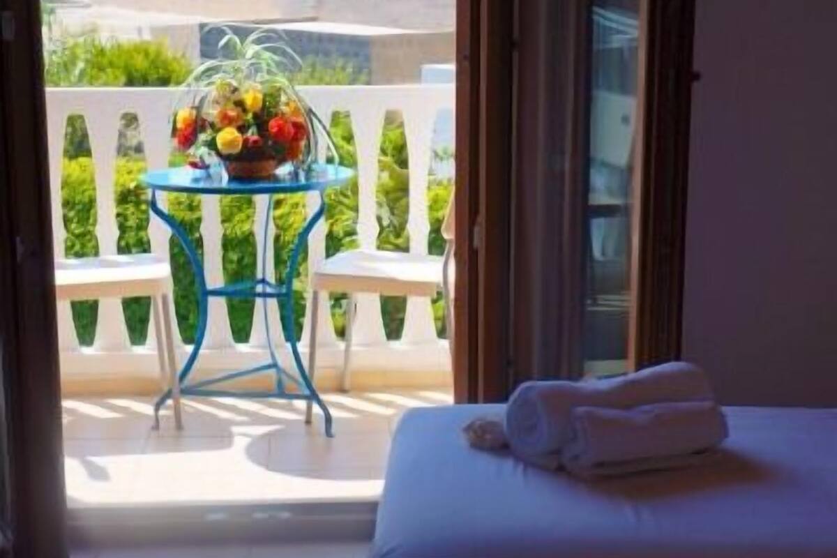 double room, pool view | in-room safe, soundproofing, iron/ironing board, free wifi