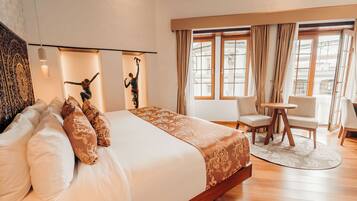 Luxury Suite, Balcony, City View | Premium bedding, minibar, in-room safe, individually decorated