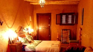 A cozy bedroom with a bed, a chair, a dresser, and a door. - Tarmguist (Asrir)