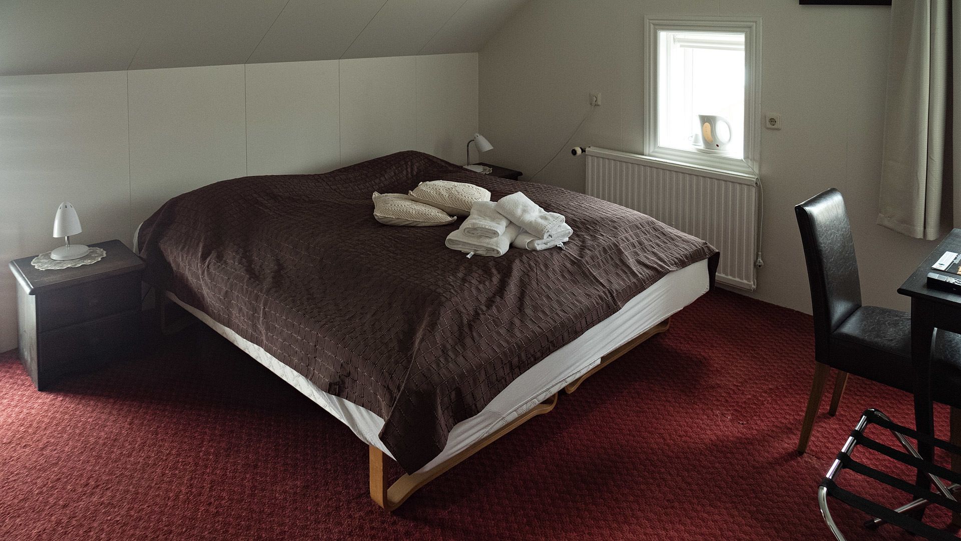 desk, laptop workspace, blackout curtains, iron/ironing board