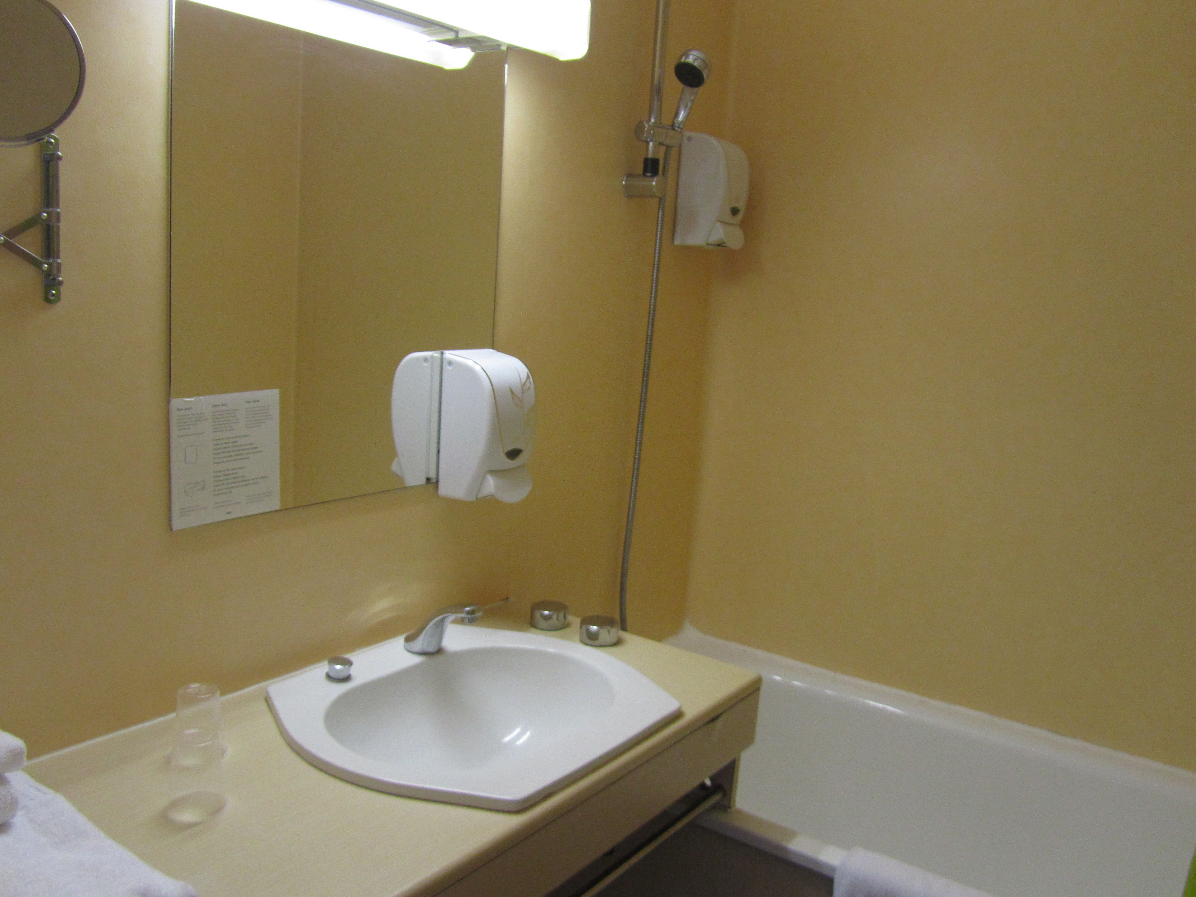 bathtub, free toiletries, hair dryer, towels