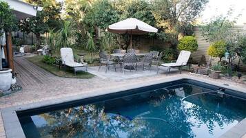 Outdoor pool, pool umbrellas, sun loungers