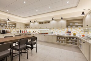 A modern kitchen with a central island, ample counter space, and built-in cabinets. - Hyatt Place Page Lake Powell (Page)