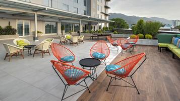 Relax on the rooftop terrace with a variety of seating options and enjoy the scenic views of mountains and water.