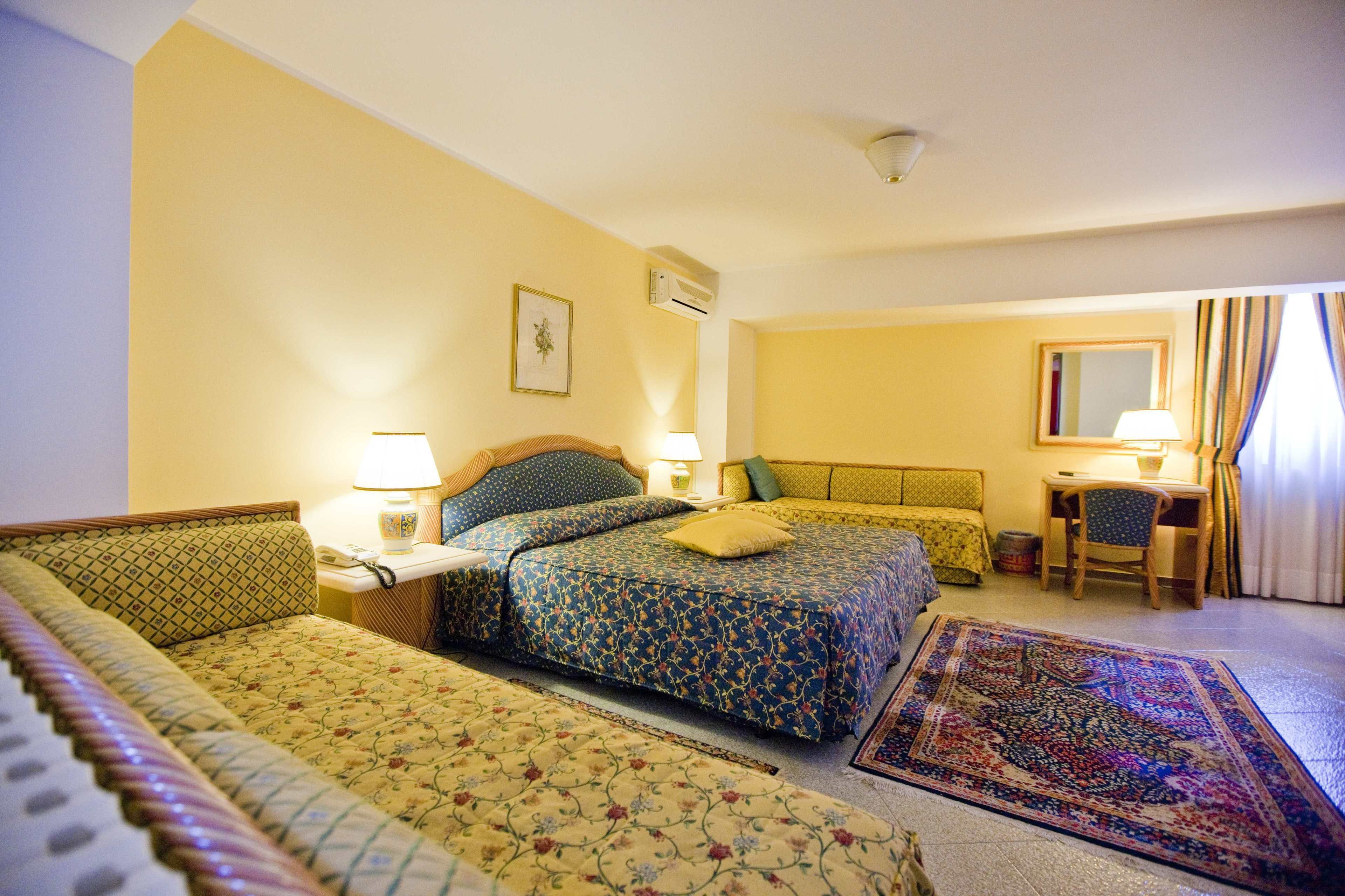 deluxe quadruple room, 1 bedroom, ocean view | premium bedding, in-room safe, desk, soundproofing