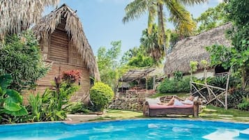 The Palapas - think romance, think "Glamorous Camping" | In-room safe, desk, bed sheets