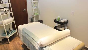 Cozy retreat with a single bed, shelf unit, and ladder, perfect for a relaxing stay.