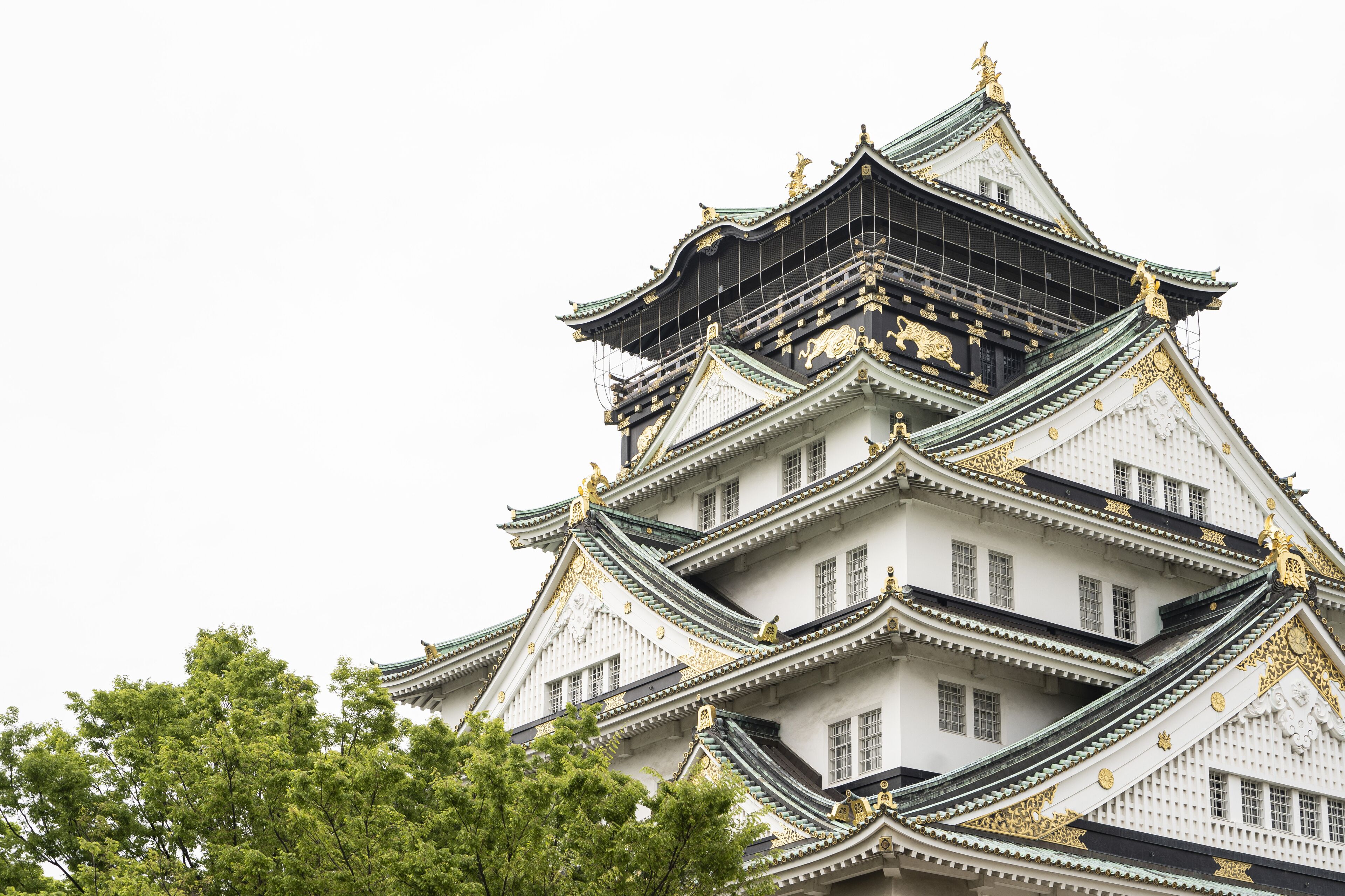 A multi-tiered castle-like structure with intricate architectural details and golden accents.