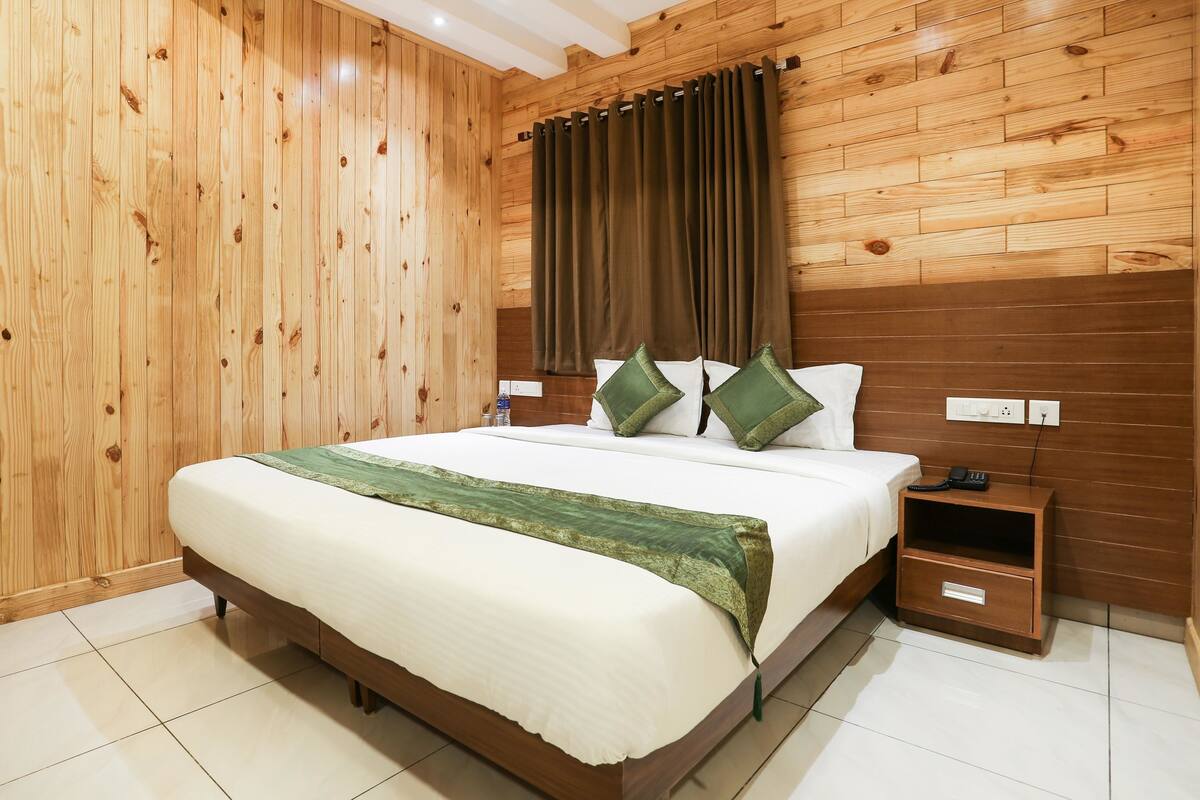 Minibar, desk, blackout curtains, iron/ironing board