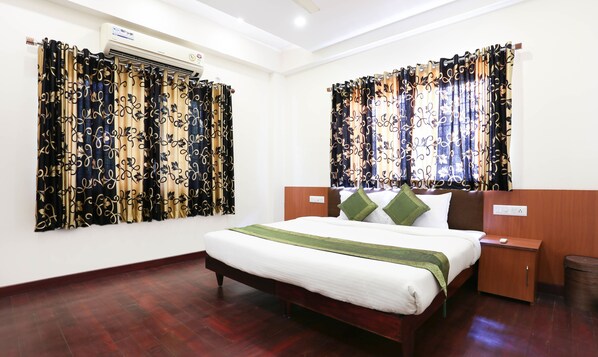 Minibar, desk, blackout curtains, iron/ironing board