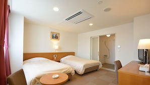 A hotel room with two beds, a desk, a chair, a TV, and a shower area. - PRINCE HOTEL Second View MURORAN (Muroran)