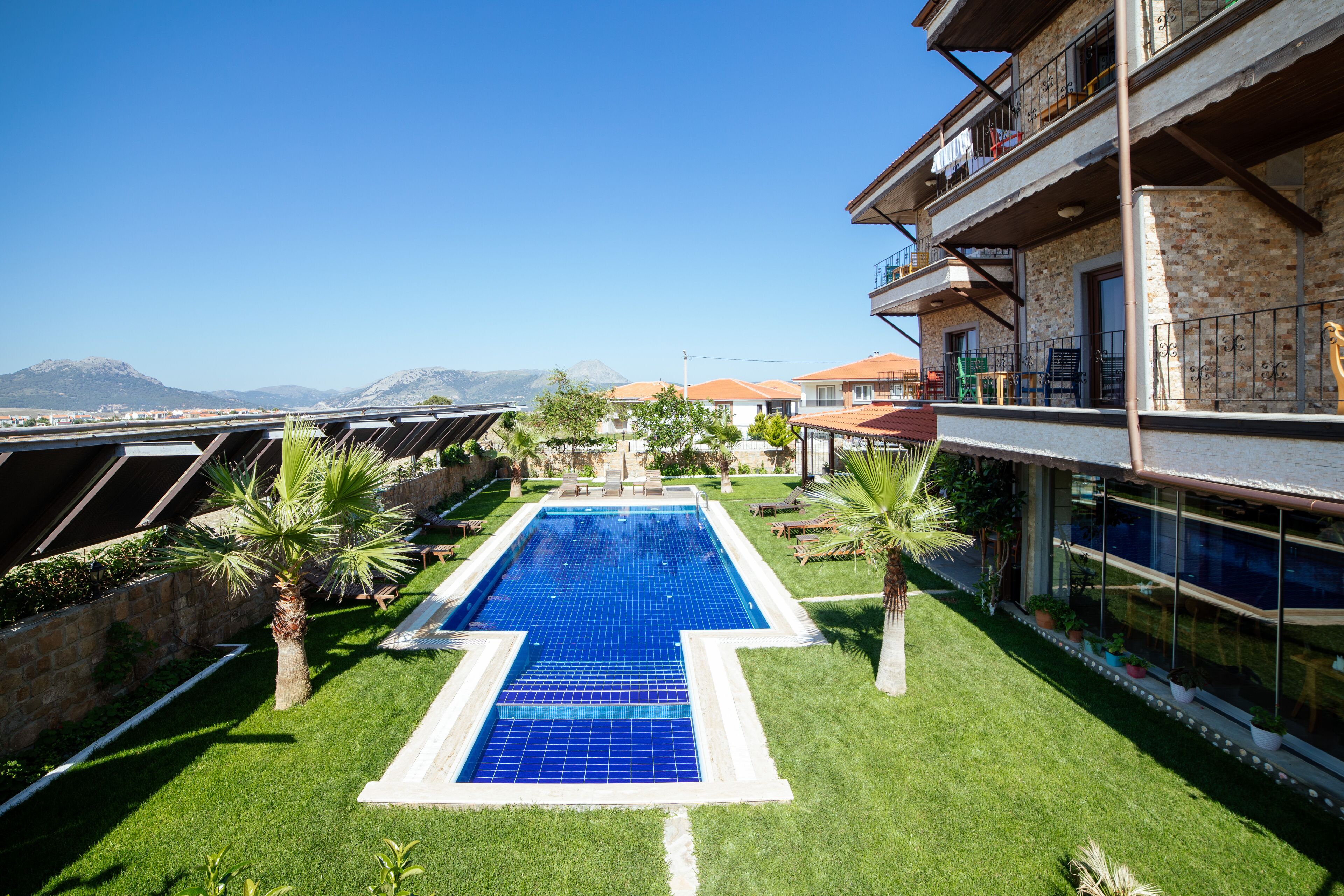 outdoor pool, pool umbrellas, pool loungers