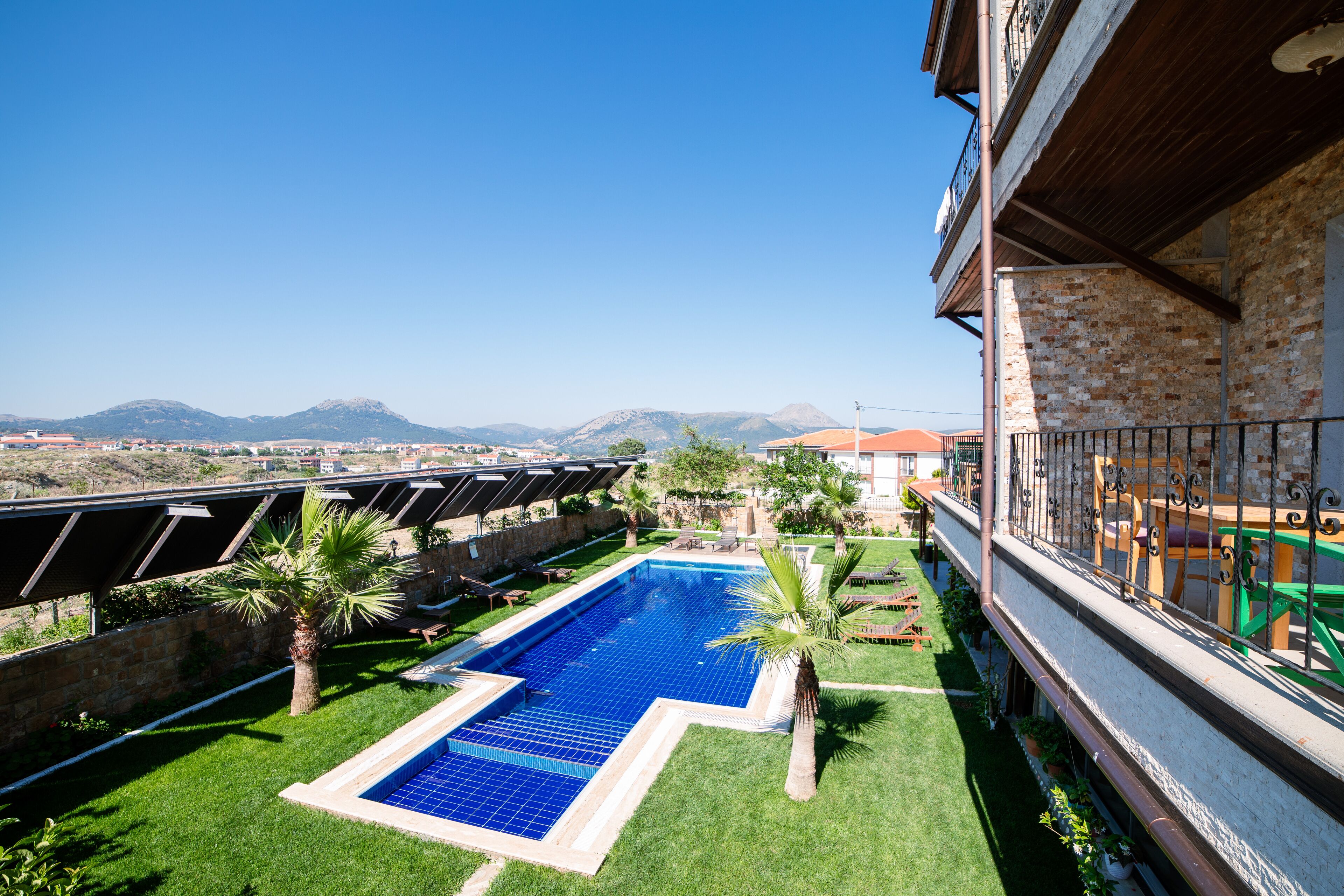 outdoor pool, pool umbrellas, pool loungers