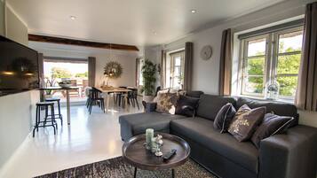 Luxury Cottage | Living room | 24-inch flat-screen TV with cable channels, TV