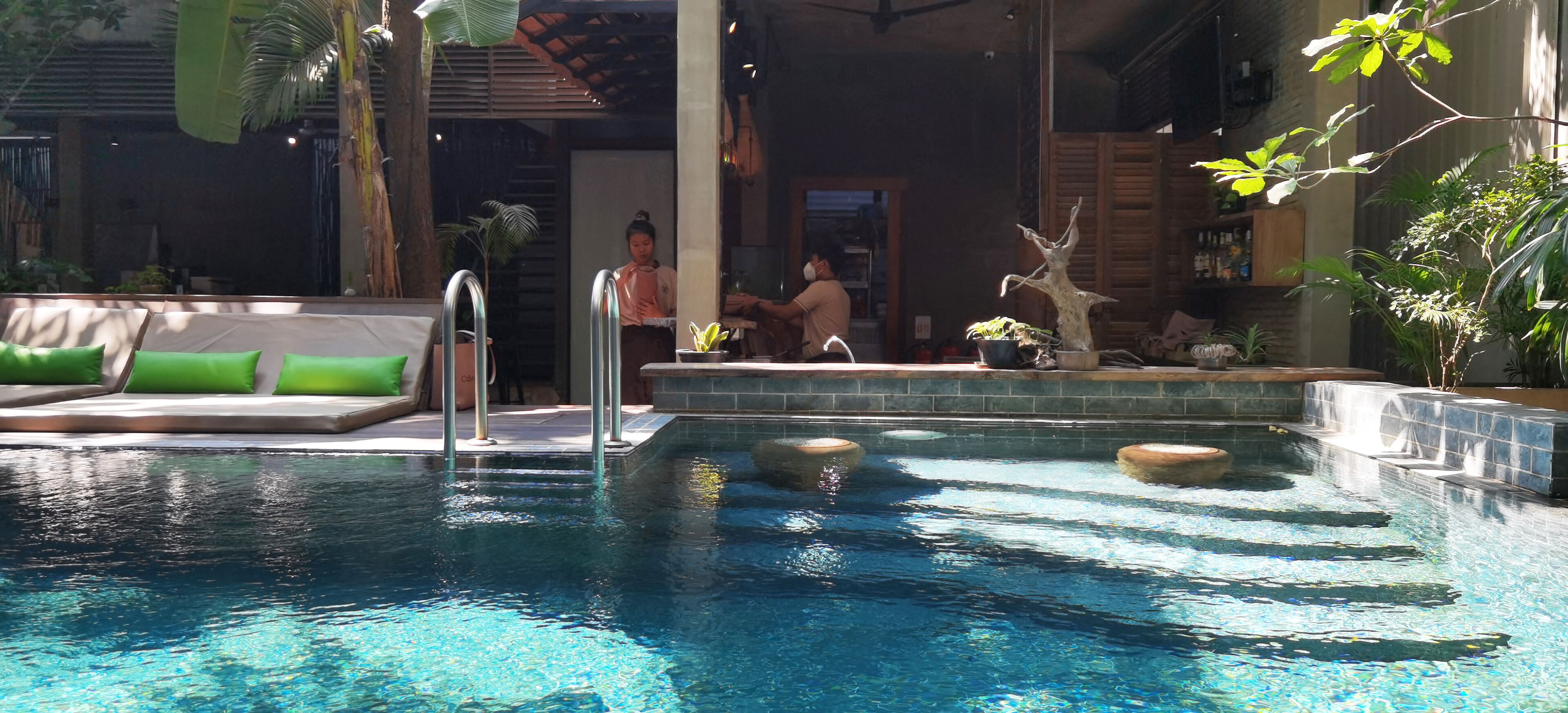 outdoor pool, open 6 am to 10 pm, pool umbrellas, pool loungers