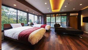 A modern hotel room with two beds, a large window, and a TV on the wall. - Hotel Hakone Terrace (Hakone)