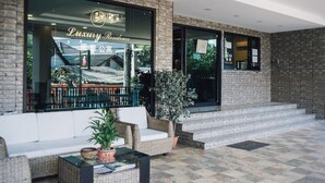 A luxury residence with a modern exterior, large windows, and a welcoming entrance. - Luxury Residence (Chiang Mai)